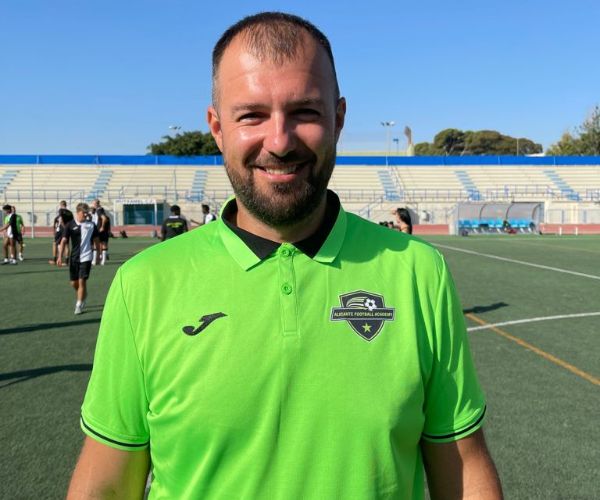 international academy coach in the soccer field in spain